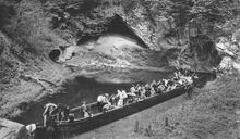 Day Boat, visitors and Castle Mill Basin, looking towards Wrens Nest tunnel entrance to the left. Main Dudley Tunnel bottom left