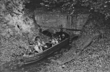 Day Boat and passengers exiting first tunnel