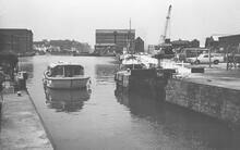 Hire boat entering lock from Gloucester Docks.1980