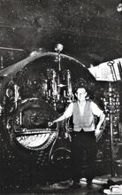 Fireman Mr Beckenham by Boiler 110 in Side Boiler House. 1953 