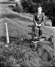 Rodney Weaver sitting on stile