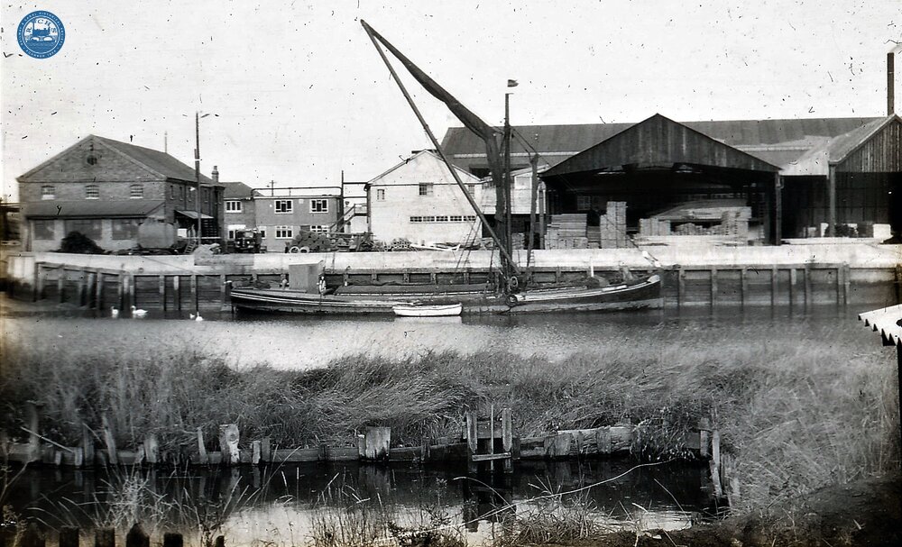 Sailing barge and dinghy at Wharf