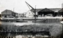 Sailing barge and dinghy at Wharf