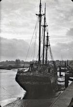 Three masted sailing craft at river quay