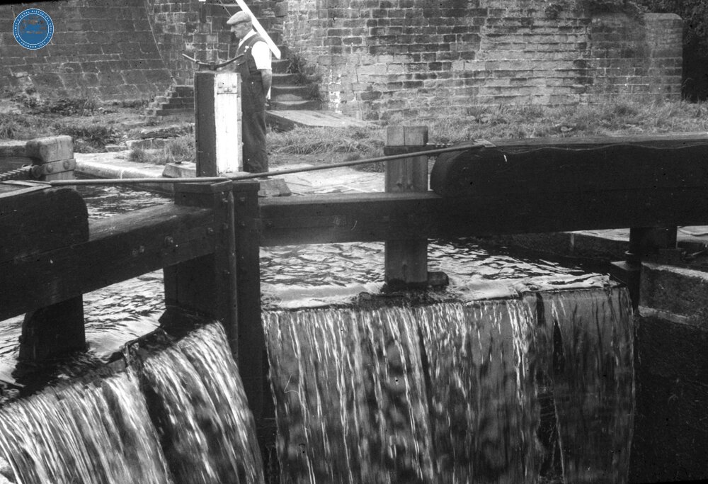Leeds & Liverpool Canal. Bingley. Five Rise Locks. A middle lock overspilling.