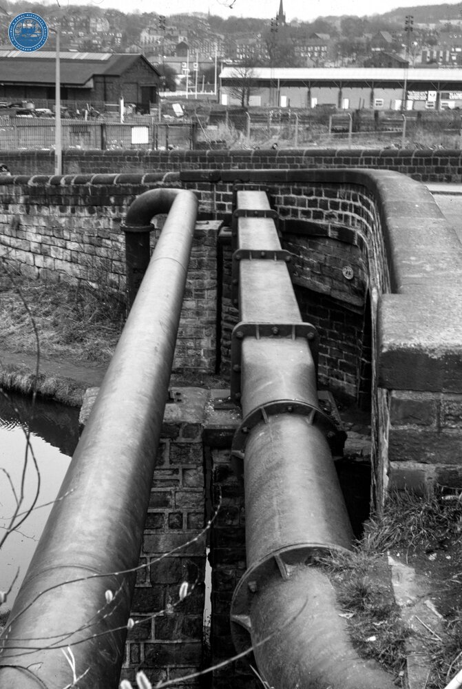 Leeds & Liverpool Canal. Bramley, Leeds. Cast Iron Pipe bridge alongside Bridge 223, Wyther Bridge