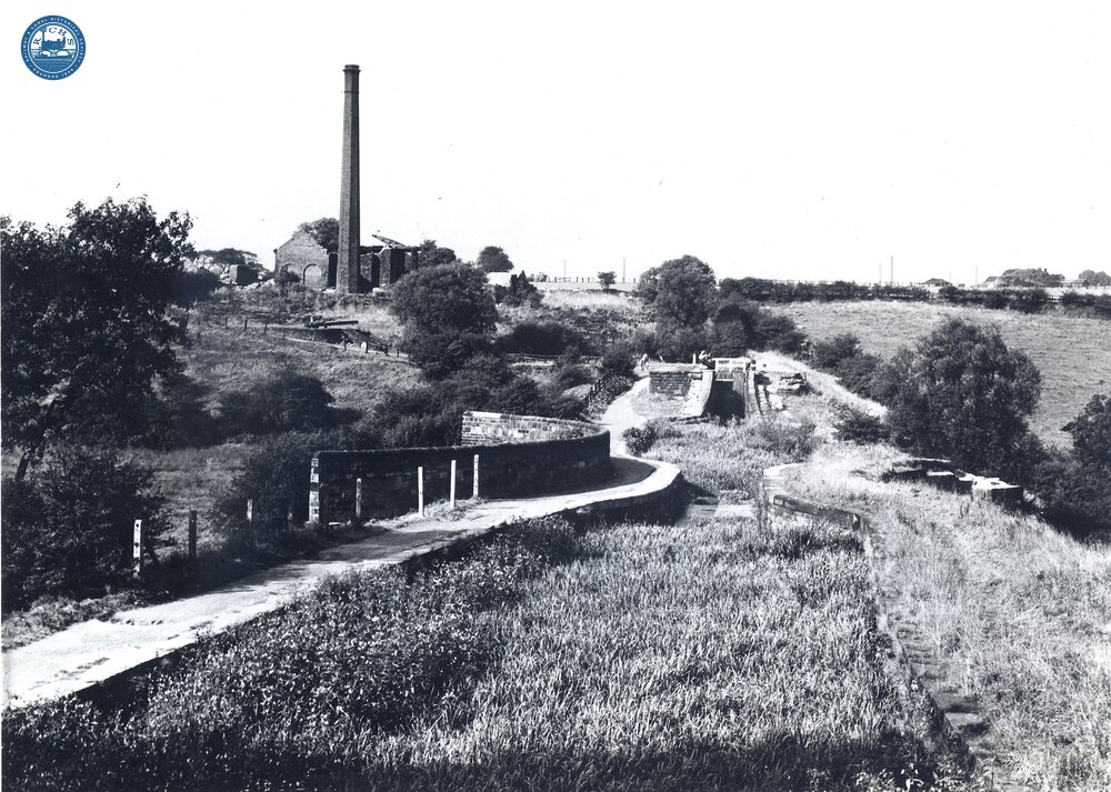 Hollingwood Branch. Medlock Aqueduct and the engine house of Old Law Colliery and locks. 1959