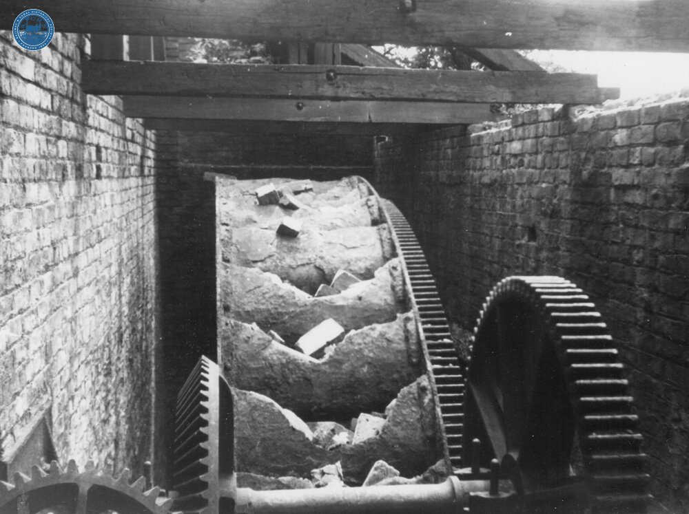 Cast iron water wheel installed at Ashton New Warehouse. June 1960