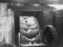 Cast iron water wheel installed at Ashton New Warehouse. June 1960