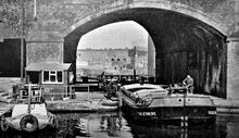 Barge leaving Hulme Bottom Lock, Manchester. 1970s