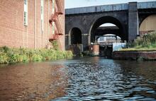 Hulme Bottom Lock, River Medlock and railway bridges. 06 September 1980