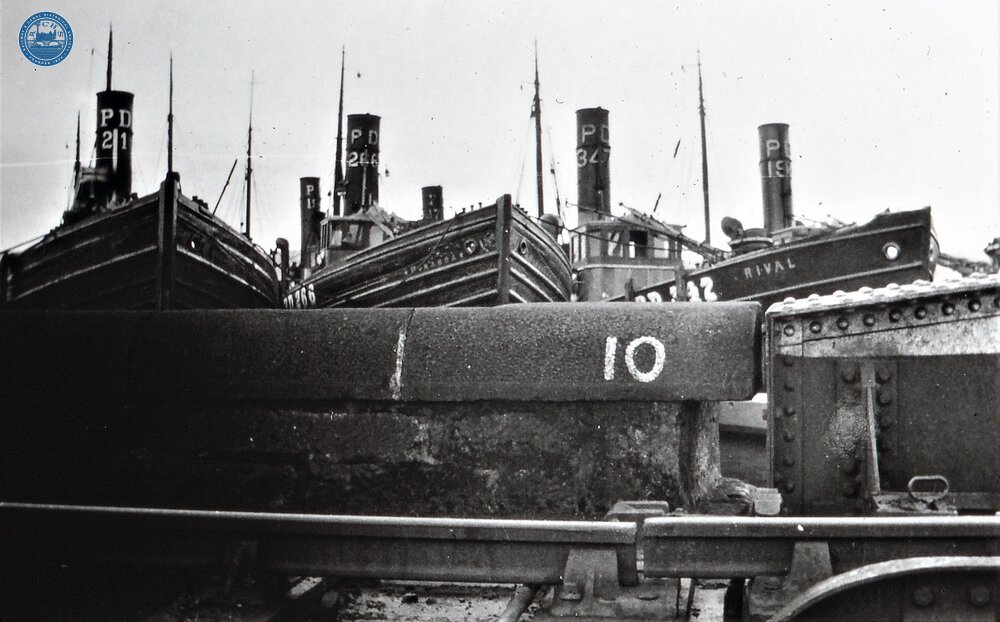 Caledonian Canal, Drifters taken over by Admiralty going E to W taken for conversion to mine sweepers, waiting at rail bridge @ Clachnaharry. Dec 1939