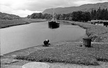 Naval cadet boat approaching lock