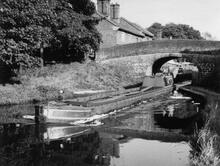 'Collingwood' is passing under Tyrley Wharf Bridge (60), having left Tyrley Top Lock (1)  (1959) 