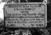 Between Wrenbury and Quoisley. Cast iron notices. June 1970