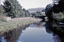 Canal with bridge with weight limit sign 