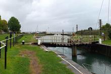 Lydney Harbour looking towards the Sea Lock with the Severn Estuary. 27 April 2024