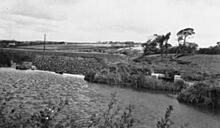 Weir near Helebridge, looking east. 1960