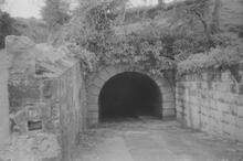 Stone tunnel portal. Date: 1961.