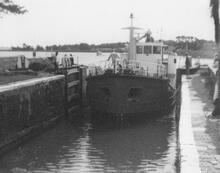 Sludge Boat,'Countess Wear' entering Turf Lock. August 1980