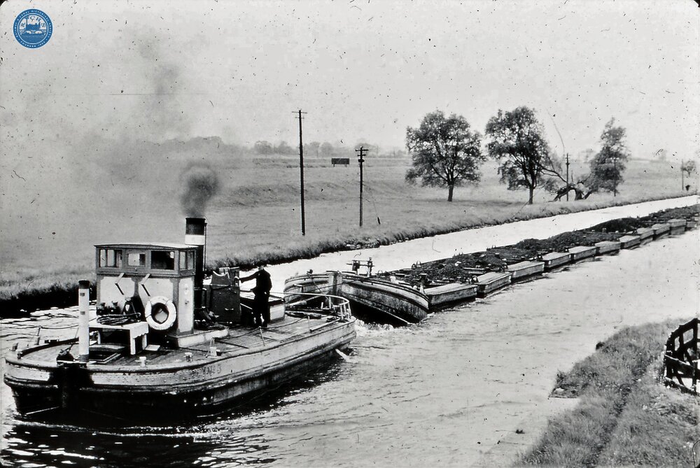 Aire & Calder Nav. Steam tug No 3 towing train of compartment boats "Tom Puddings" with false bows or Jebus at head