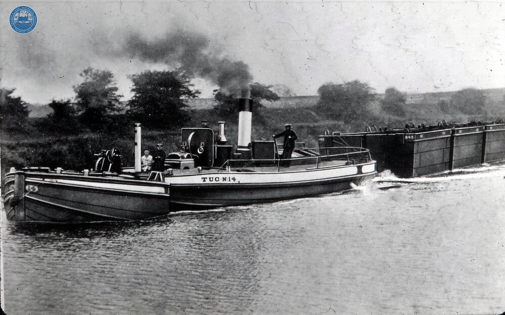 Bartholomew's Box-boats or Tom Puddings on the Aire & Calder Navigaton. Steam tug No 14 pushing the false bows (Jebus).