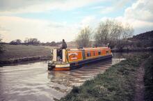 Coventry Canal. Narrowboat "Mallard" of Hertford passing the site of entrance to Newdigate Arm. 1985