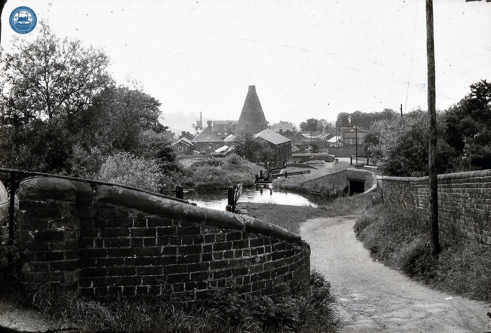 Stourbridge Canal: Locks at Buckpool with Redhouse glass cone in distance