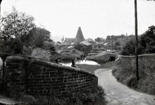 Stourbridge Canal: Locks at Buckpool with Redhouse glass cone in distance