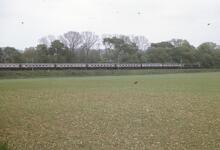 Southbound passenger train in landscape. Muscot (WCML) 20  May 1975. (Ref: 017025)
