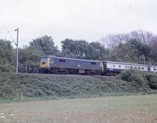 86235 BR electric loco class 86 no 86235 on northbound passenger train, Muscot (WCML) 20  May 1975 (Ref: 017027)