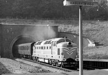 Deltic prototype DP1 at speed emerging from Hadley Wood South tunnel 1959 (ECM1 @ 10:46) (Ref: 010697)