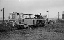 Plasser and Theurer 07-275 switch and crossing liner/tamper DB963831, plus trailer DB965932. Stratford on Avon 20 November 1975 (Ref: 012228E 75_7_11) 