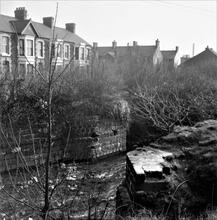 Taibach Tramroad. Abutments of former tramroad bridge over the River Ffrwdwyllt at the east end of Park View. April 1963 (2)