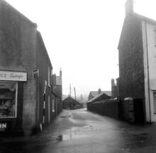 Kidwelly & Llanelly Canal and Tramroad Co. Burry Port. Former trackbed at the level crossing over Station Road. Map ref. SN 4478 0080 facing north. October 1963 (1)