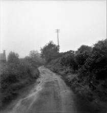 Kidwelly & Llanelly Canal and Tramroad Co. The line of the former trackbed running along a lane between New Street and Colby Road. Map ref. SN 449 010 looking north. October 1963 (2)