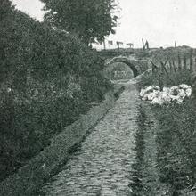 Forest of Dean Railway (14)  near Cinderford. Section of disused cobbled track. Also, the overbridge erected by the Cinderford Iron Co in 1827