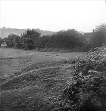 Caerleon Tramroad. The embankment curving below the Castle, southeast towards the river.  May 1960 (7)