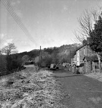 23331  Hen Neuadd Tramroad (1), Abercrave. Facing west at SN 812126 with the “Rheolau Arms” on the left and the “Old Shop” on the right. The terminus of the canal is at the back of the public house. April 1963