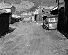 Resolven. J W Lyon’s colliery tramroad, now a lane behind Commercial Road.  Photo taken from NGR SN 8285 0294, facing north-west, April 1963.
