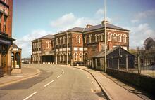 Oswestry station frontage (GNQ4 @ 18m 16ch). 20 April 1986