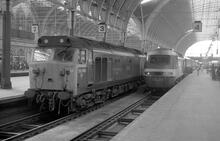 Paddington (MLN1 @ 0m 00ch). Class 50 50049 "Defiance" + class 253 253001. 23 May 1978