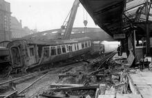 Royal Oak Station 7 November 1940. (HTH@ 0m 47ch) . Damage to track, train and station buildings following air raid. (Ref: 030798)