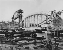 Saltash, Cornwall. Royal Albert Bridge (MLN2 @ 250m 70ch - 251m 23ch). View during construction from the construction yard on the Devon side