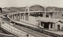 Saltash, Cornwall. Royal Albert Bridge (MLN2 @ 250m 70ch - 251m 23ch). View from above Saltash station during the broad gauge era