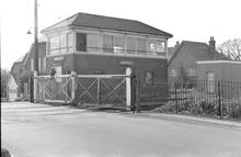 Bramley (BKE @ 46m 41ch) Signal Box and level crossing viewed from the roadside, east side. (Ref: 325233E  C8_25)