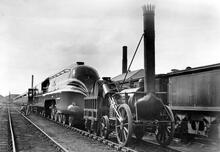Coronation Class 4-6-2 "Coronation" when new with a replica of Stephenson's Rocket 25 May 1937. (Ref: 010683)