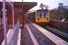 Salford Crescent station (MVE1 @ 1m 59ch). 1st day of enhanced services. West platform looking South. 15 May 1989