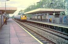 Burnage station (STY @ 7m 18ch). EMU set 004 heading southbound. 30 May 1987