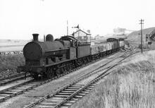 Hadlow Briggs Sidings (BUX @ 4m 41ch – 4m 78ch) on the Buxton to Ashbourne line. LNWR G2 0-8-0 No 49406 with unfitted mixed freight train